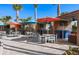 Relaxing poolside cabanas with tables, chairs, and TVs at 1166 Aloha Blvd, Davenport, FL 33897