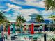 Inviting resort-style pool with lounge chairs and colorful umbrellas at 1166 Aloha Blvd, Davenport, FL 33897