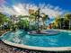 Stunning resort-style pool with a waterslide and lush landscaping at 1166 Aloha Blvd, Davenport, FL 33897