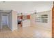 Bright dining room with tile floor and view into kitchen area at 618 El Camino Real S, Lakeland, FL 33813