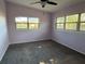 Large bedroom with two windows and a ceiling fan at 2331 Olney Rd, Lakeland, FL 33801