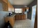 Cozy kitchen featuring wood cabinets and granite countertops at 2331 Olney Rd, Lakeland, FL 33801