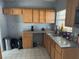 Kitchen features wood cabinets, granite counters and appliances at 2331 Olney Rd, Lakeland, FL 33801