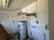 Laundry area with water heater and shelving at 2331 Olney Rd, Lakeland, FL 33801