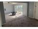 Bright living room featuring a ceiling fan and access to a patio at 2331 Olney Rd, Lakeland, FL 33801
