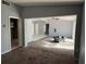 Open living room with view into adjacent kitchen area at 2331 Olney Rd, Lakeland, FL 33801