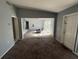Spacious living room with large windows and carpeting at 2331 Olney Rd, Lakeland, FL 33801