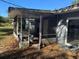 Home exterior featuring a covered screened porch at 2331 Olney Rd, Lakeland, FL 33801