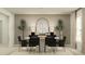 Modern dining room with round table and six black chairs at 1279 Inkberry Cir, Deland, FL 32720