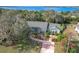Aerial view of a waterfront home with a spacious yard at 151 Pine St, Babson Park, FL 33827