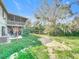 Large backyard with lush greenery and a play area at 151 Pine St, Babson Park, FL 33827