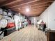 Unfinished basement with wood flooring and storage at 151 Pine St, Babson Park, FL 33827