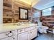 Bathroom with wood-look walls and updated vanity at 151 Pine St, Babson Park, FL 33827