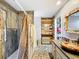Spa-like bathroom with walk-in shower, pebble flooring and unique sink at 151 Pine St, Babson Park, FL 33827