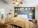 Bright bedroom with king-size bed, dresser, and access to kitchen at 151 Pine St, Babson Park, FL 33827