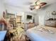 Spacious bedroom with ensuite bathroom access, ceiling fan, and plenty of natural light at 151 Pine St, Babson Park, FL 33827