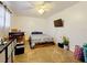 Bedroom with a double bed, tiled floors, and ceiling fan at 151 Pine St, Babson Park, FL 33827