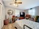 Bedroom featuring a bed, dresser, and ceiling fan at 151 Pine St, Babson Park, FL 33827