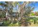 Charming house with lush landscaping and mature trees at 151 Pine St, Babson Park, FL 33827