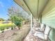 Relaxing front porch with comfortable seating and a stone floor at 151 Pine St, Babson Park, FL 33827