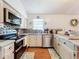 Updated kitchen featuring stainless steel appliances and wood floors at 151 Pine St, Babson Park, FL 33827