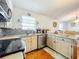 Updated kitchen with stainless steel appliances and wood look floors at 151 Pine St, Babson Park, FL 33827