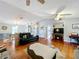 Open living space with hardwood floors, a fireplace, and comfortable furniture at 151 Pine St, Babson Park, FL 33827