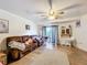 Spacious living room with tiled floors, a ceiling fan, and access to a patio at 151 Pine St, Babson Park, FL 33827