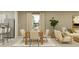 Open concept dining area with light wood table and six beige chairs at 1299 Inkberry Cir, Deland, FL 32720