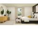 Bright bedroom with a comfortable bed, dresser, and plenty of natural light at 1299 Inkberry Cir, Deland, FL 32720