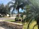 View of the house from across the street, showing landscaping at 384 Arbella Loop, The Villages, FL 32162