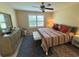 Spacious main bedroom with a king-size bed and ample natural light at 384 Arbella Loop, The Villages, FL 32162