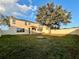 Large backyard with grassy area and tree at 2504 Preserve Ct, Mulberry, FL 33860