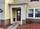 House entrance with red door and decorative glass at 2504 Preserve Ct, Mulberry, FL 33860