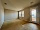 Spacious living room with neutral carpeting and tile at 2504 Preserve Ct, Mulberry, FL 33860