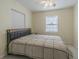 Bedroom with double bed, window, and ceiling fan at 1039 W 12Th St, Lakeland, FL 33805