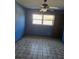 Blue bedroom with tile flooring and ceiling fan at 748 Merrimac Dr, Port Orange, FL 32127