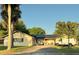 House exterior with solar panels and a large driveway at 748 Merrimac Dr, Port Orange, FL 32127