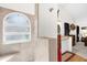 Shower with an arched window and beige tile surround at 2739 Everleth Dr, Lakeland, FL 33810