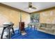 Cozy sunroom with seating area, grill, and backyard view at 2739 Everleth Dr, Lakeland, FL 33810