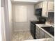 Modern kitchen with grey cabinets and new appliances at 333 Lake Howard Nw Dr # 204C, Winter Haven, FL 33880