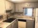 Updated kitchen with grey cabinets and granite countertops at 333 Lake Howard Nw Dr # 204C, Winter Haven, FL 33880