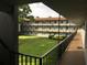 View of a condo building with a grassy courtyard at 333 Lake Howard Nw Dr # 204C, Winter Haven, FL 33880