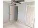 Bright bedroom with large closet and ceiling fan at 333 Lake Howard Nw Dr # 204C, Winter Haven, FL 33880