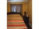 Cozy bedroom with striped bedding and a nightstand at 11390 E Irlo Bronson Memorial Hwy, St Cloud, FL 34773