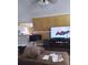 Living room with large TV, brown couch and tiled floors at 11390 E Irlo Bronson Memorial Hwy, St Cloud, FL 34773