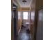 Long hallway with linoleum flooring and doors leading to other rooms at 11390 E Irlo Bronson Memorial Hwy, St Cloud, FL 34773
