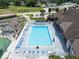 Community pool with surrounding lounge chairs at 1967 Long Boat Dr, Lakeland, FL 33810