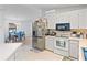 Modern kitchen with stainless steel refrigerator and white cabinetry at 1967 Long Boat Dr, Lakeland, FL 33810