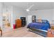 Bright bedroom with hardwood floors, a large bed, and built-in shelving at 1967 Long Boat Dr, Lakeland, FL 33810